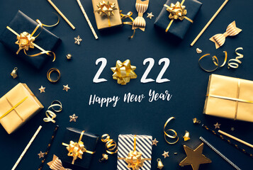 Wall Mural - 2022 happy new year celebration concepts with gift box and ornament in golden color on dark backgrou