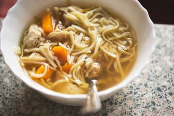 Wall Mural - Chicken soup with carrot, vegetables and pasta 