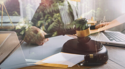 Business and lawyers discussing contract papers with brass scale on desk in office. Law, legal services, advice, justice and law concept picture with film grain effect