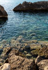 Poster - Beautiful shot of rocky beach with sunrays