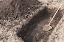 Digging A Pit. Pit In The Ground. The Shovel  In The Pit.