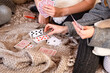 © ako-photography - hands of people playing cards at home, selective focus, focus is on cards