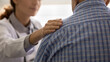 © fizkes - Female GP doctor giving empathy, support to senior 80s sick man, touching shoulder. Elderly male patient getting bad news, geriatric disease, pessimistic diagnosis from therapist. Banner