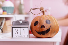 Wooden Calendar Show Date 31 October Halloween Day And Pumpkin On Wooden School Table In The Girls Pink Room. Halloween Decorations Concept