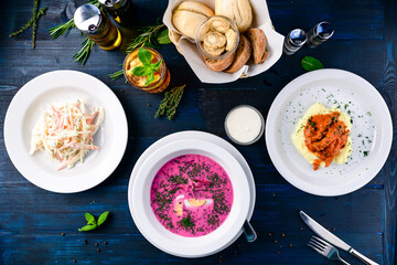 Poster - Top view of a three course set menu served on wooden table