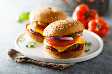 Sticker - Traditional homemade cheeseburgers on a plate