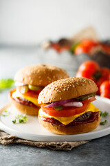 Sticker - Traditional homemade cheeseburgers on a plate