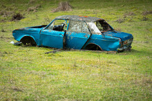 Old Abandoned Car In The Field