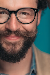 Sticker - happy bearded young man with glasses smiling and posing in studio