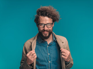 Sticker - sexy curly hair guy with glasses adjusting jacket and smiling