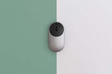 Wireless computer mouse on color background, technology concept