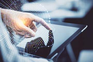 Double exposure of man's hand holding and using a digital device and brain hologram drawing. Data concept.