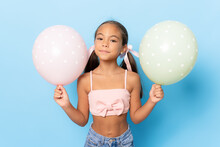 Beautiful Little Girl With Pastel Colors Air Balloons Isolated Over Blue Background.
