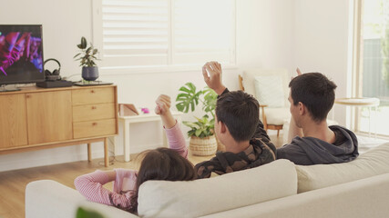 Wall Mural - Children praying with father, family and kids fellowship worshiping online together at home, digital streaming church service, social distancing, lockdown concept