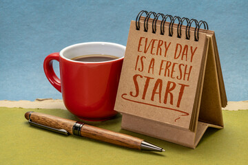 Wall Mural - every day is a fresh start inspirational note - handwriting in a desktop calendar with coffee, lifestyle, optimism, positivity and personal development concept