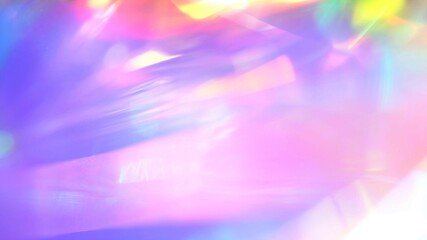Wall Mural - A holographic rainbow unicorn pastel purple pink teal colors abstract background. Optical crystal prism flare beams. Neon light flares
