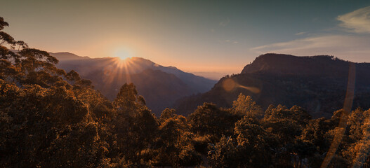 Canvas Print - Mountain valley during bright sunrise. Beautiful natural landscape. Perfect sunset