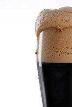 Glass Of Fresh And Cold Dark Beer On A Gray White Light Background.