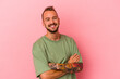 © Asier - Young caucasian man with tattoos isolated on pink background  happy, smiling and cheerful.