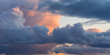 Fototapeta Na sufit - Beautiful colored dramatic cumulus clouds on sky at sunset