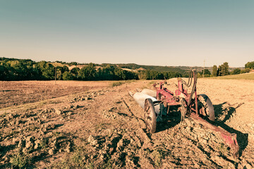 Sticker - Closeup of a plow standing on a hill in the idyllic Tuscan countryside