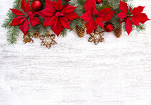 Christmas Tree With Christmas Balls, Christmas Gingerbread, Flowers Of Red Poinsettia And Cones Spruce On A Wooden Background With Space For Text. Top View, Flat Lay
