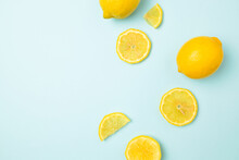 Ripe Yellow Lemons On Blue Background With Copy Space For Your Text. Top View. Flat Lay Pattern, Banner. Frame Made Of Fresh Lemons
