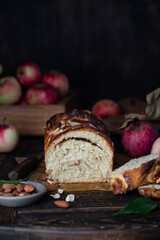 Wall Mural - apple babka bread with cinnamon on a wooden table