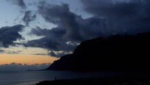 Cinematic Clip Of Magnificent Summer Evening Beach And Glorious Mountains. Time-lapse Of Beautiful Sunset And Moving Colorful Dark Clouds.