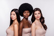 © Beauty Hero - Photo of three young attractive woman beauty cosmetology procedure moisturizing isolated over grey color background
