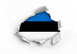 Flag of Estonia underneath the ripped paper