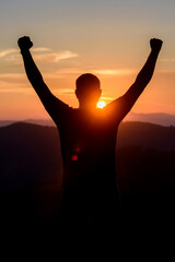 Canvas Print - Free man raising arms to golden sunset summer sky. Freedom, success and hope concept