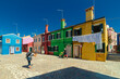 Tourist photographer takes photo of colorful houses in Burano