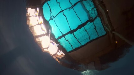 Sticker - Underwater view of the empty swimming pool with calm waves and sun rays