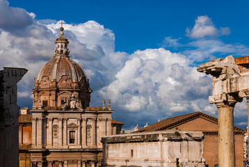 Wall Mural - Rome historical center ancient and baroque monuments with beautiful clouds