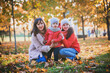 © irishasel - Mother and her child girl playing together on autumn walk in nature outdoors.Active games of happy family, lifestyle in autumn yellow park.movement, defocus, selective focus