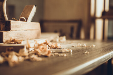 Wall Mural - Plane jointer carpenter or joiner tool and wood shavings. Woodworking tools on wooden table