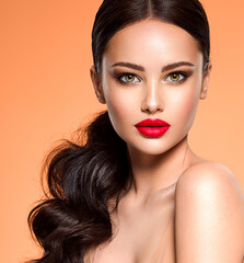Wall Mural - beautiful white girl with a red lipstick on lips. stunning brunette girl with long hair tail. closeu