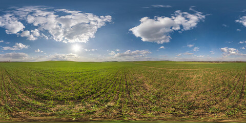 Wall Mural - 360 seamless hdri panorama view among green fields with white clouds in blue sky in equirectangular spherical projection, ready AR VR virtual reality content