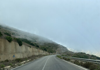 Canvas Print - Dangerous road mountains with a lot of fogs