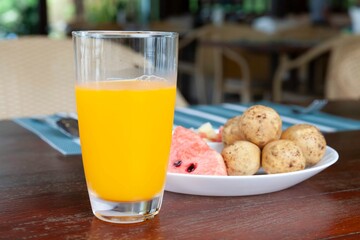 Wall Mural - Breakfast set, orange juice and fresh fruit