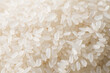 © zhikun sun - raw white rice textured background