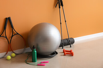 Sticker - Set of sports equipment on floor near color wall