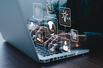Businessman using on laptop computer in office with virtual interface icons network diagram and digital marketing, Financial and banking, Digital link tech, big data.