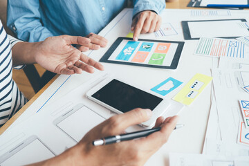 Creative Web Designer planning application and developing template layout, framework for mobile phone. User experience (UX) concept.