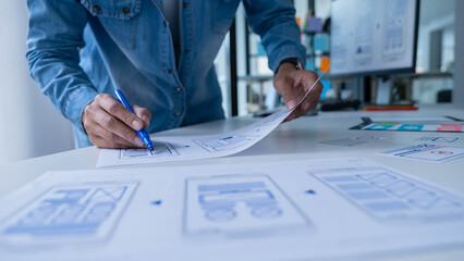 Creative Web Designer planning application and developing template layout, framework for mobile phone. User experience (UX) concept.