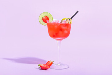 Glass of tasty cosmopolitan cocktail on color background