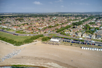 Poster - Aerial view of Goring by Sea beach with the popular Cafe with the greensward in view behind the beach at this popular seaside resort.