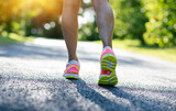 Fototapeta Sport - Fitness woman runner ready for running on sunny tropical park