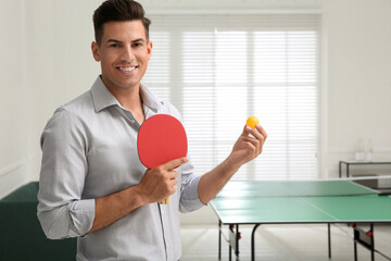 Poster - Businessman with tennis racket and ball near ping pong table in office. Space for text